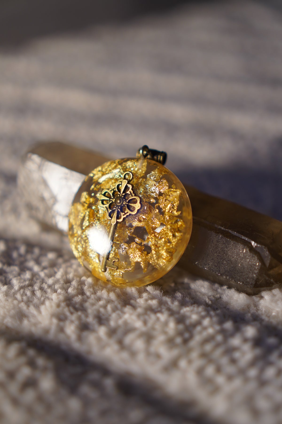 Filigree Bronze Key Resin Pendant, handmade by Aura Pendants